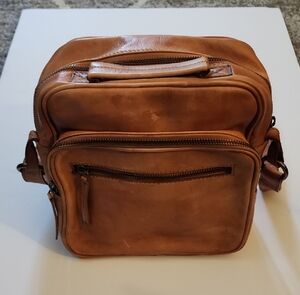 Free People Baxter Distressed Tan Leather Crossbody Bag.